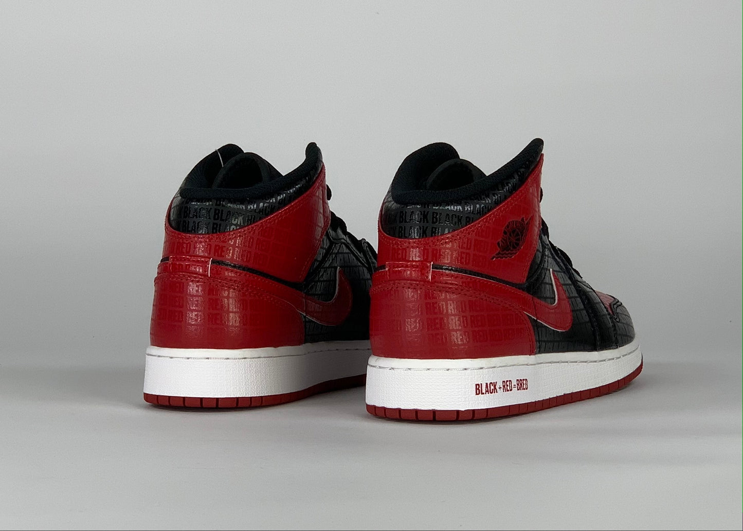 Jordan 1 Mid Bred Text