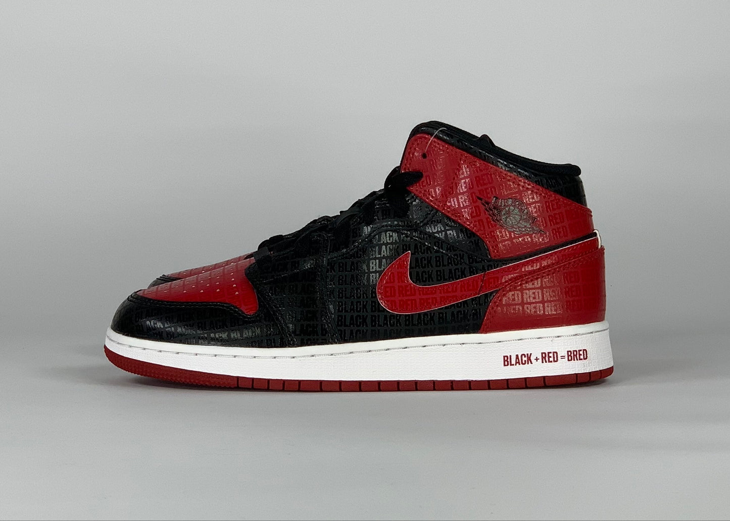 Jordan 1 Mid Bred Text