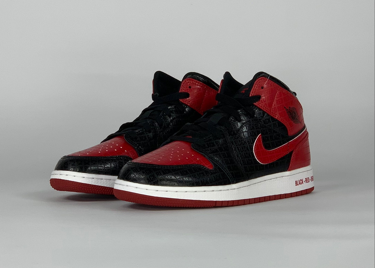 Jordan 1 Mid Bred Text